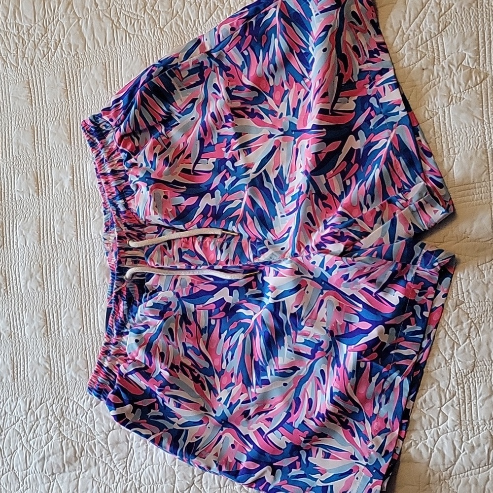 Simply Southern multi color lined swim trunks.